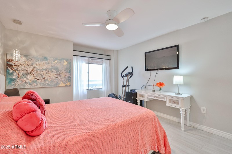 Primary bedroom with TV