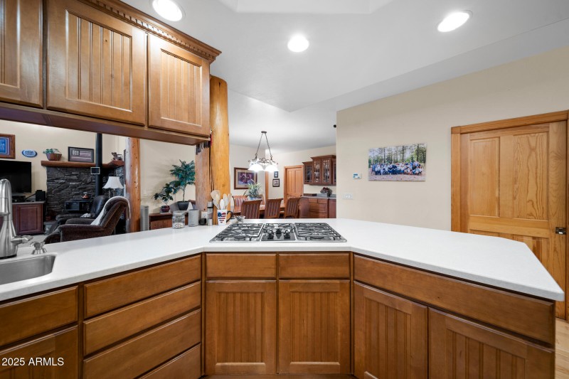 F view of gas stove top into dining room