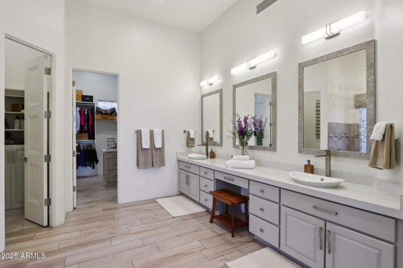 Primary Bath With Dual Walk-In Closets