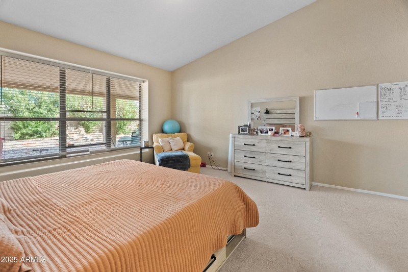 picture window overlooks backyard