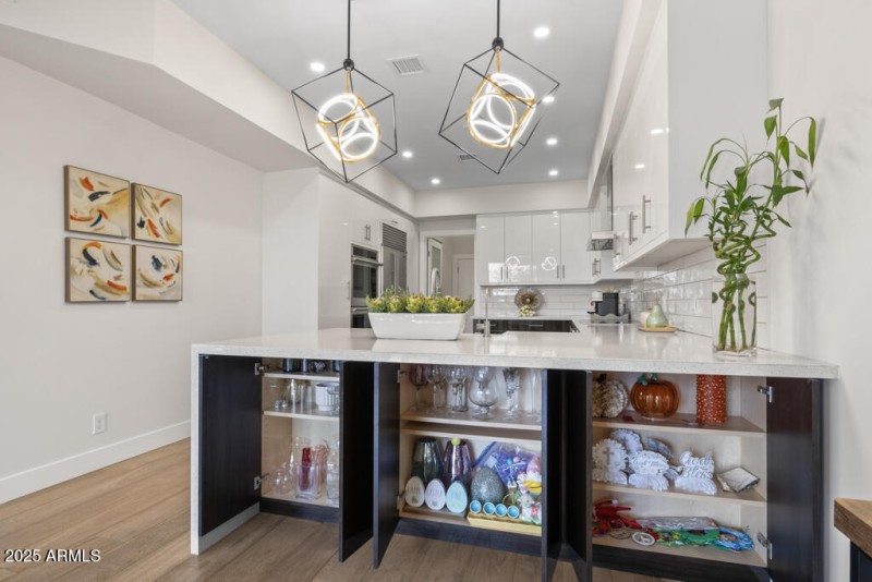 Image showing island cabinets open