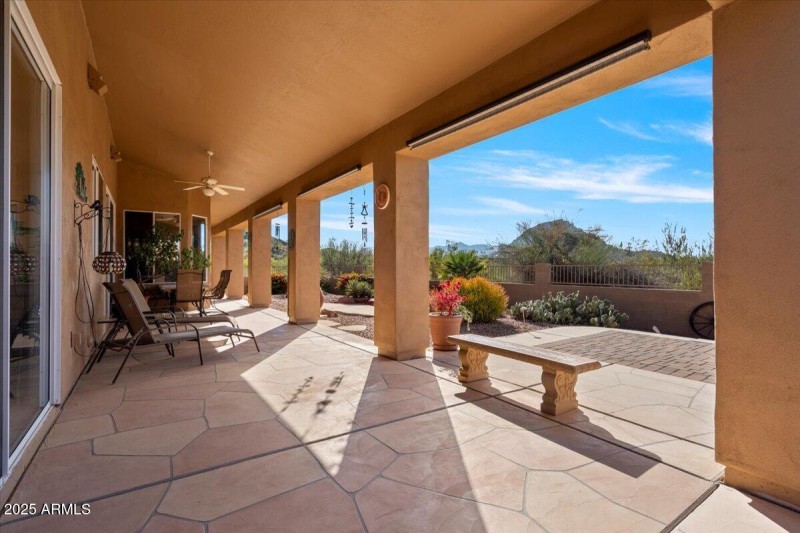 Backyard porch area with drop down shade