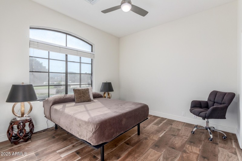 Sunlit Bedroom with Arched Window