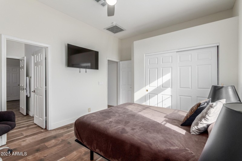 Bright Bedroom with TV Wall