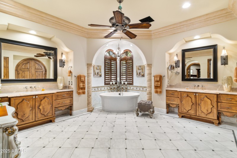 Primary Bathroom Tub and Dual Vanities