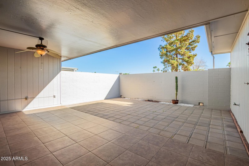 Tiled Covered Patio with Fan.