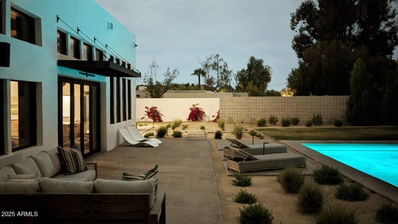 BACK PATIO AND PART POOL AT NIGHT