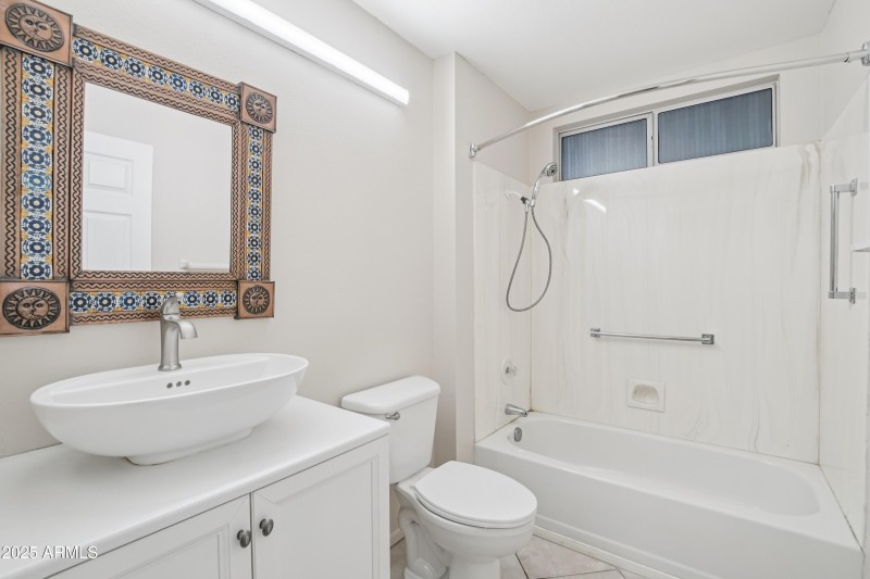 Guest bathroom with tub and shower