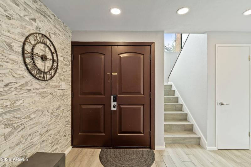 Front door and stairs w storage