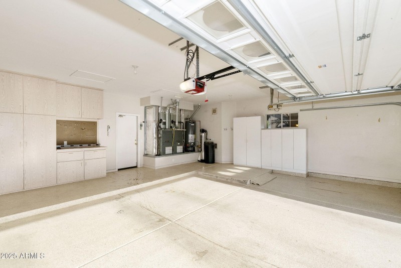 Garage with cabinets and work bench