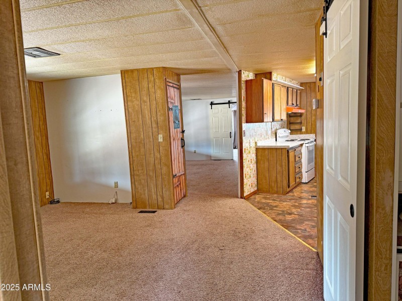 21 Family room looking to kitchen & livi