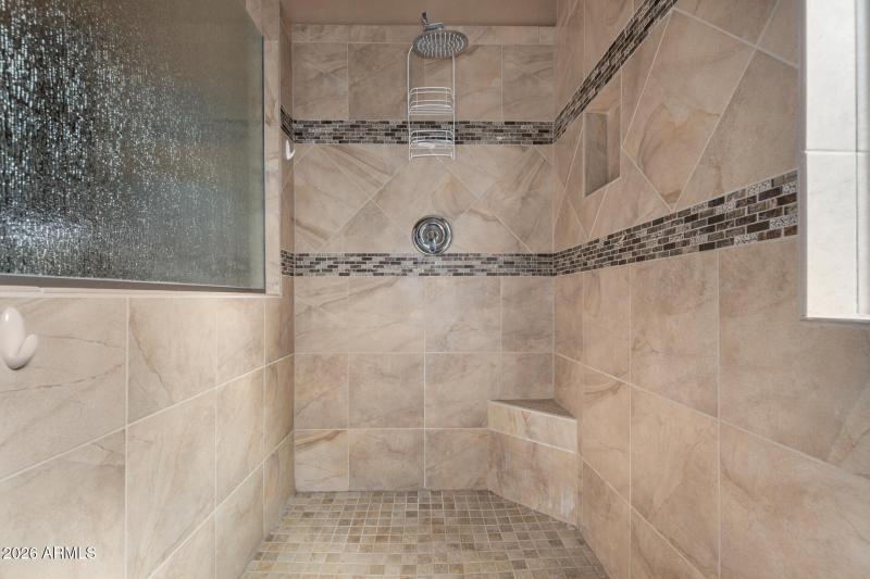 With custom tile walk-in shower