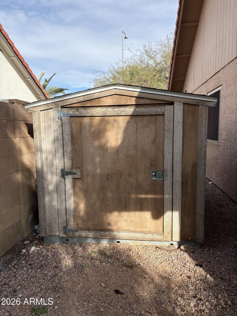 Shed in back yard on side of home