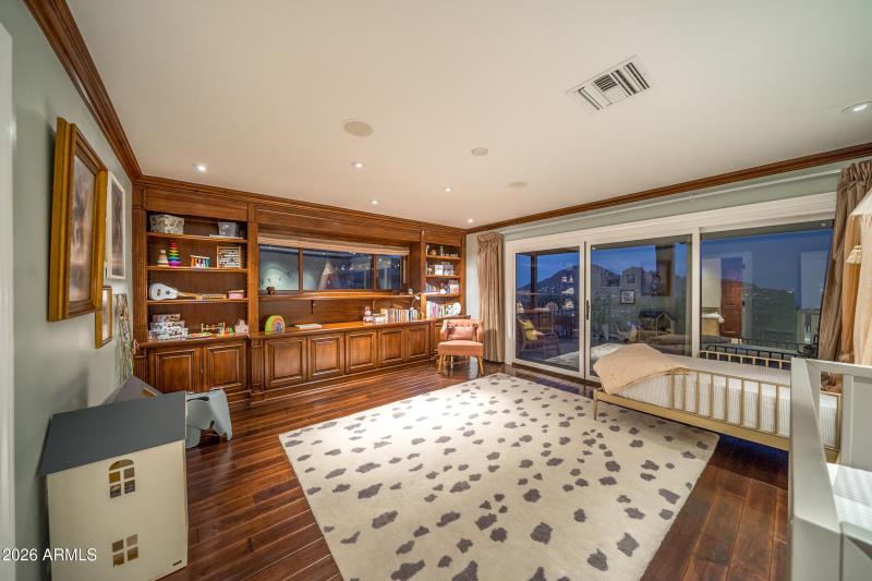Main Floor Guest Room with Rich Hardwood