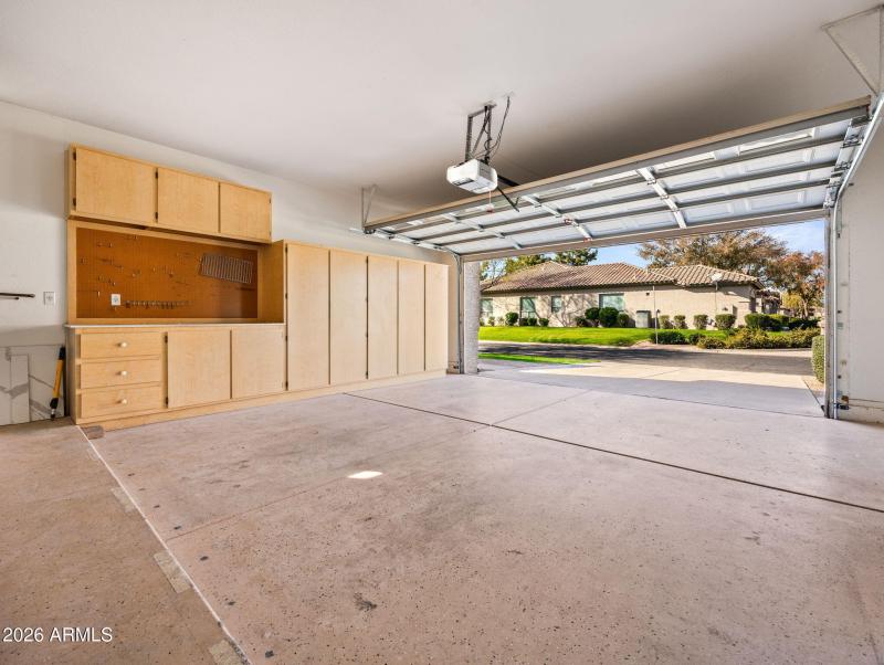 Spacious Garage with Cabinets w/ Worktop