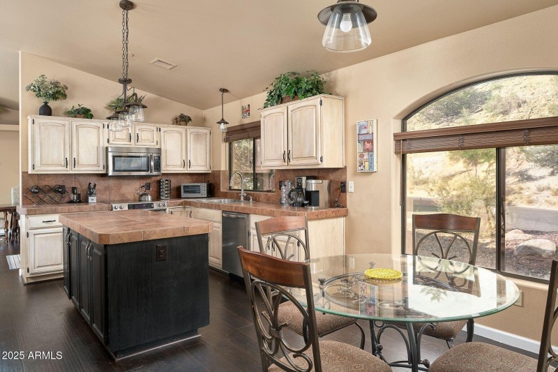 Nice view of kitchen table and layout of