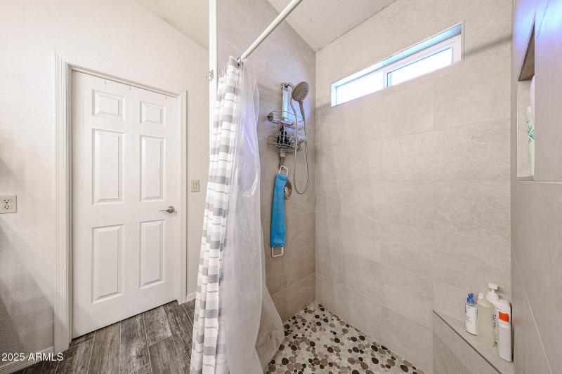 Shower with walkin closet behind