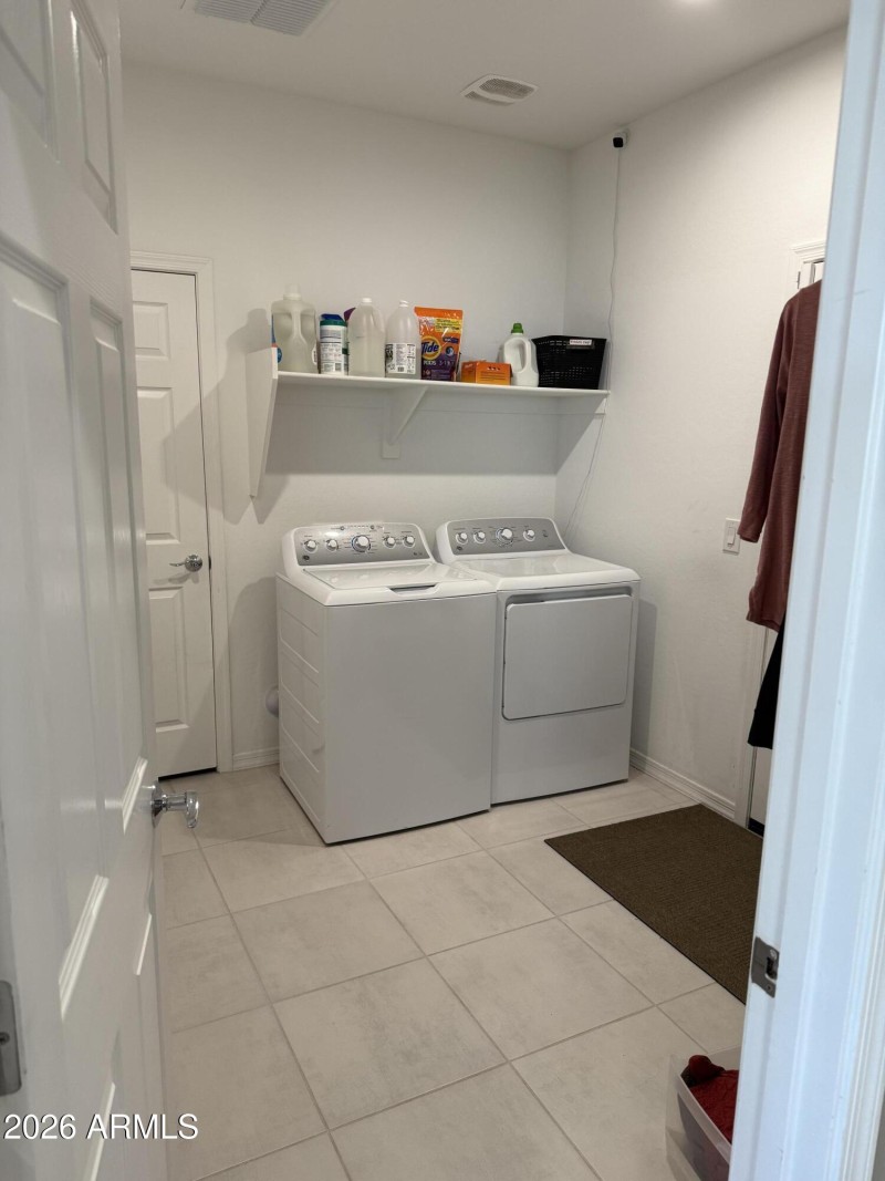Laundry with access to flex room