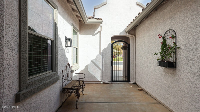 Front Entry Courtyard w/ Iron Gate