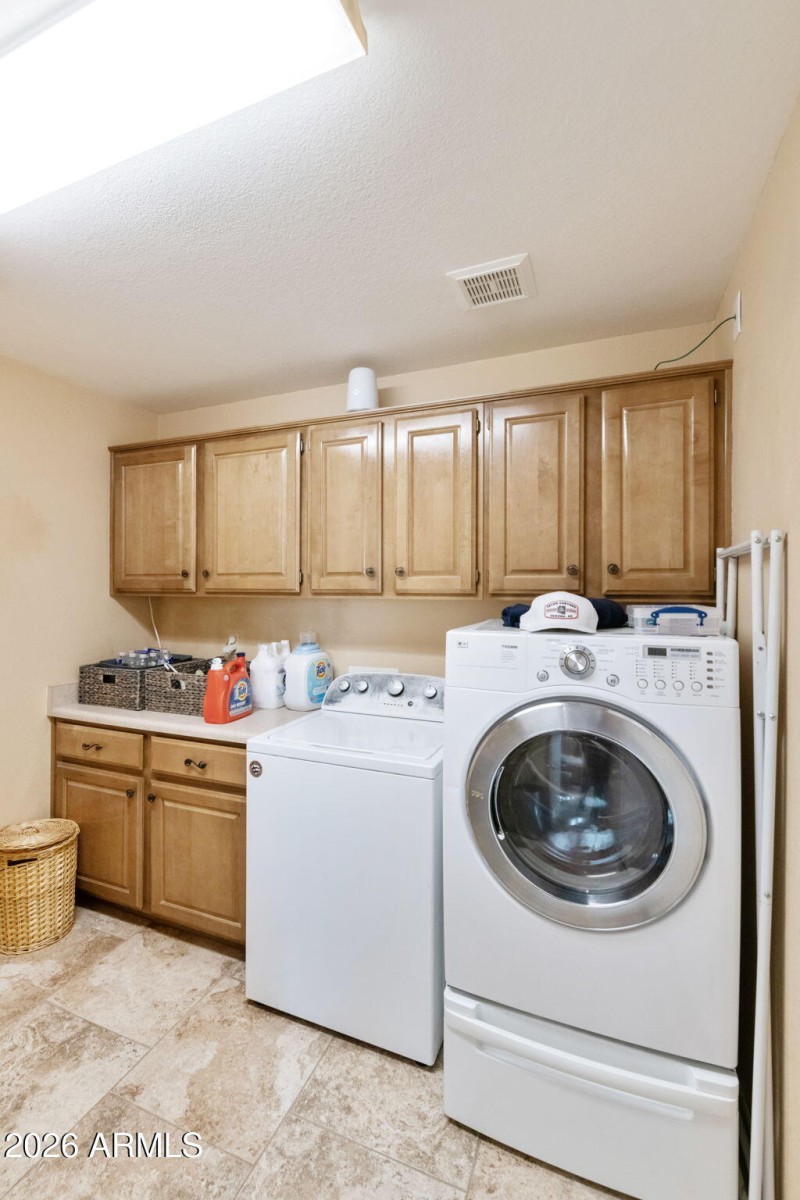 Laundry room with cabinets