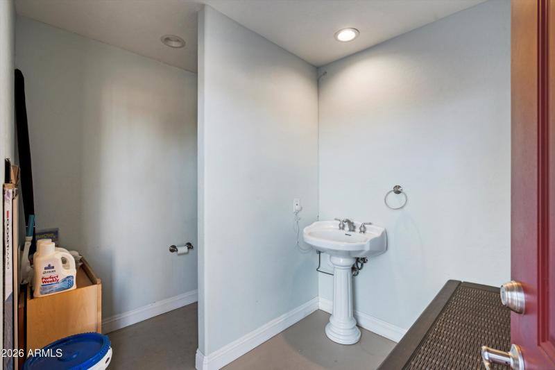Poolside Bathroom with Sink and Toilet