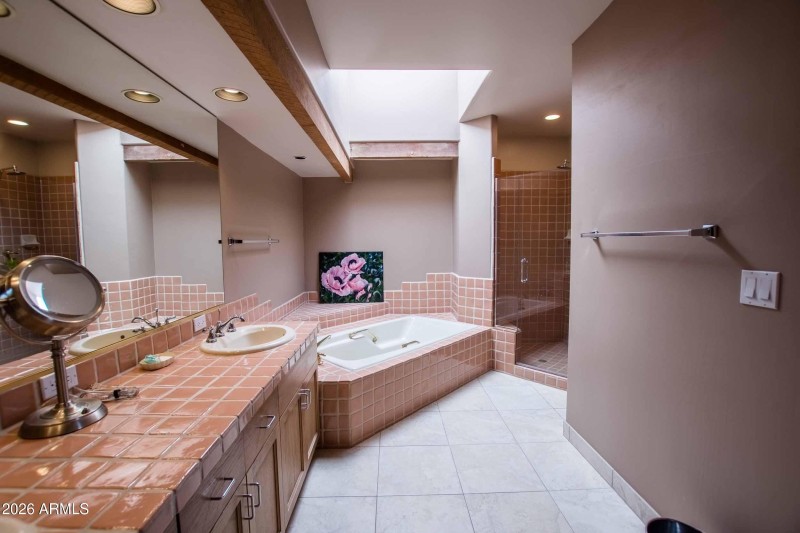 master bath with dual vanities shower an