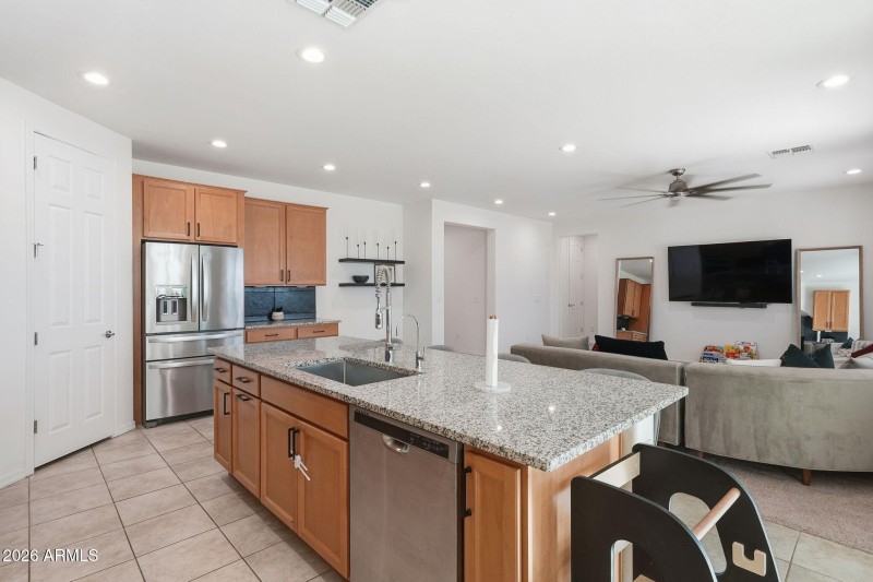 Open kitchen overlooks living room area