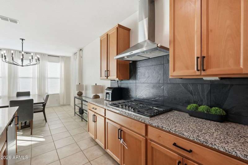 SS Wall Hood compliments backsplash