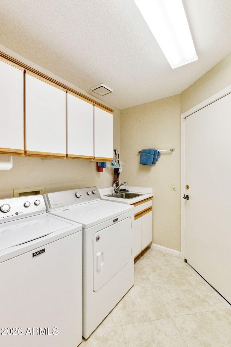 Laundry Room with cabinets/sink