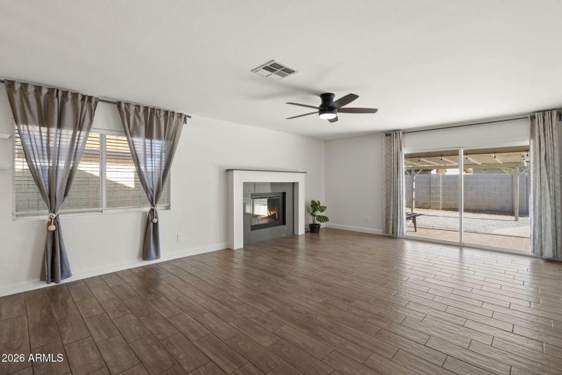 Cozy fireplace and slider to backyard