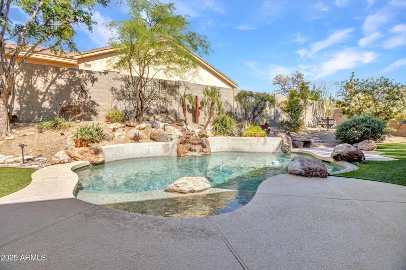 Private pool with lush backyard