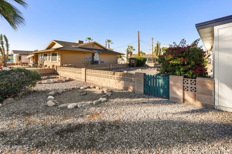 Side entrance to spacious backyard