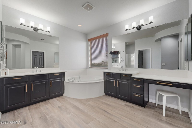 Primary bathroom with dual vanities
