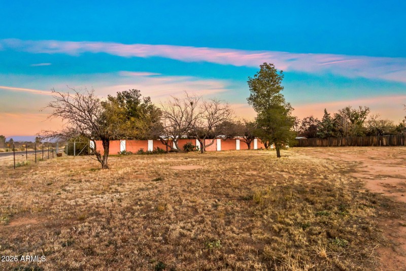 Yard past gated backyard