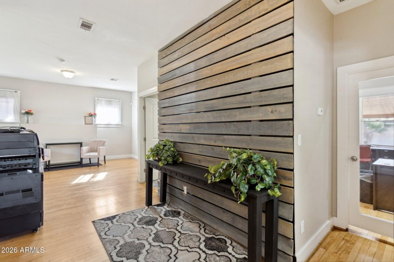 Formal entry w wood detailing