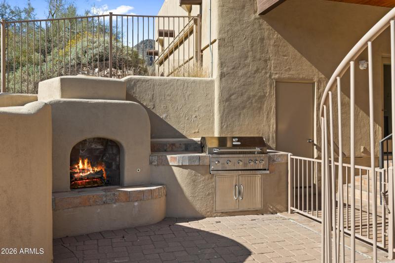 Outdoor BBQ and cozy fireplace
