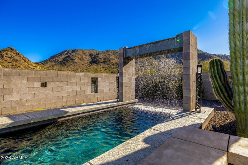 Lap pool with cascading water feature