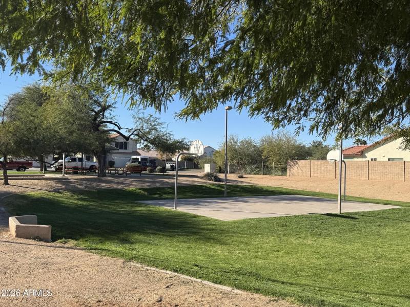 Shaded park featuring basketball court