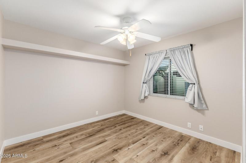 2nd Bedroom – Neutral tones, ceiling fan