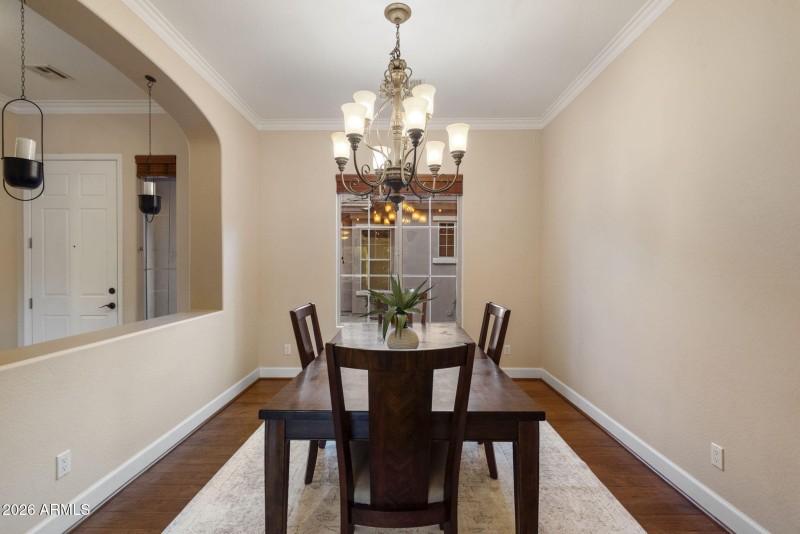 Dining w Chandelier & Courtyard Views