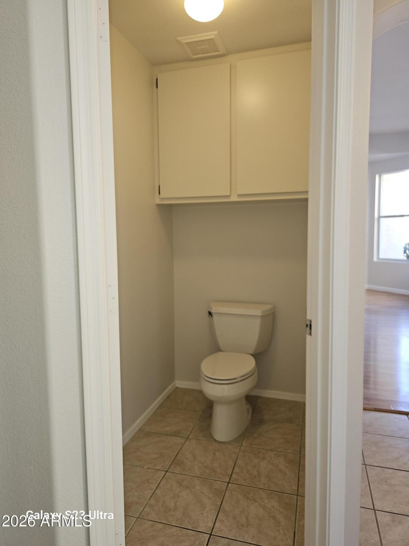 private closet w/ cabinet
