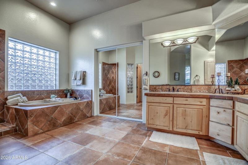 Primary bathroom tub closet entry
