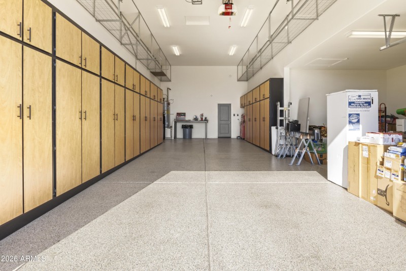 RV Garage with Cabinets and Racks Above