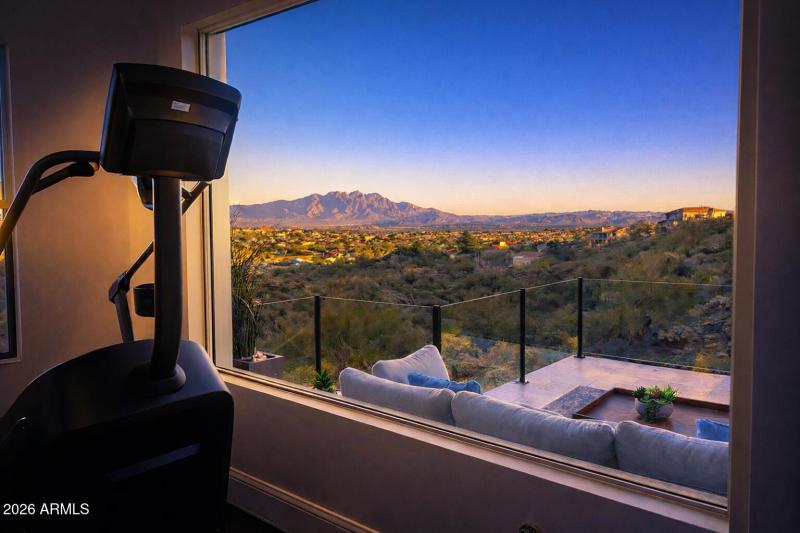 Treadmill and desert sunset view