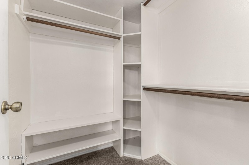 Primary Bedroom walk in closet