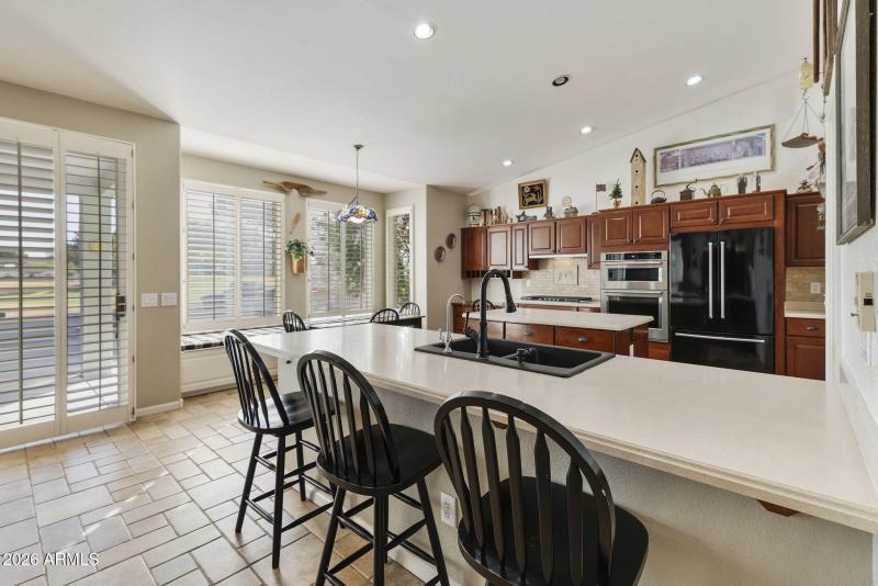 Kitchen breakfast bar and patio access