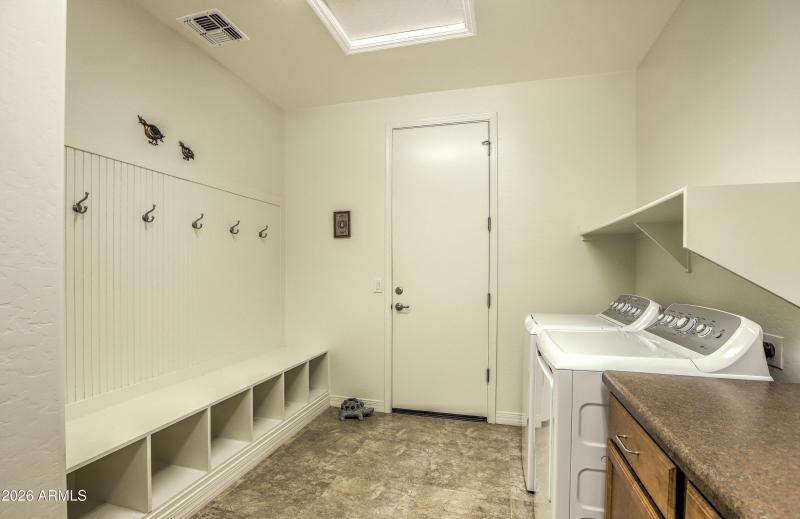 Entry from garage + storage