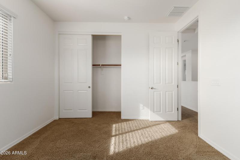 Closet view of secondary bed 1