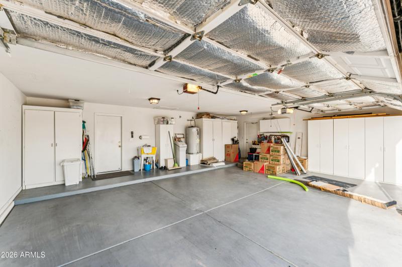 3 CAR GARAGE WITH STORAGE CABINETS