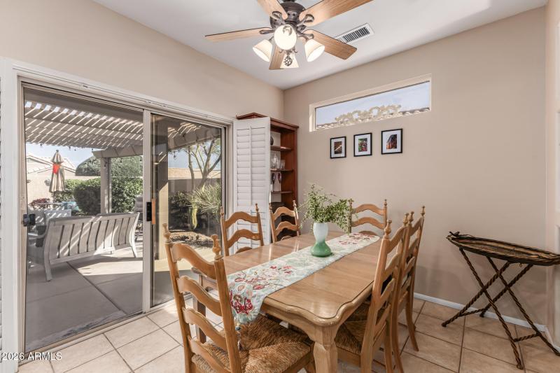 Dining area overlooks backyard oasis